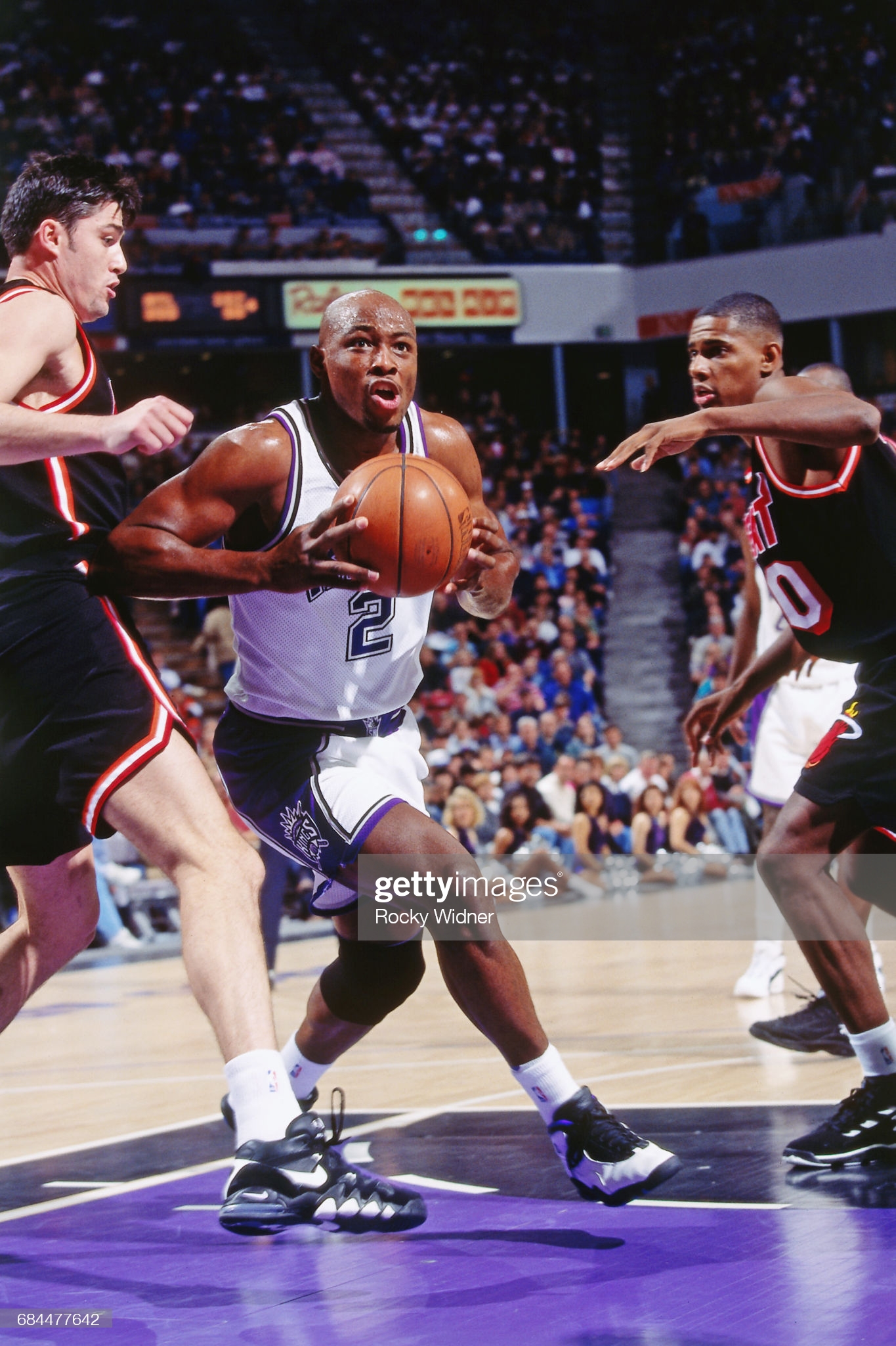 Mitch Richmond wearing the Air Jordan 10 Sacramento PE (different than the general release colorway) against the Heat. on 1/1/1995 from Rocky Widner/Getty